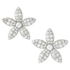 A pair of Victorian jasmine diamond earrings, each in the design of a five-petalled diamond encrusted jasmine head with a central old brilliant-cut diamond, the diamonds estimated to weigh a total of approximately 5 carats, all cut-down set in silver to a yellow gold mount and pin and scroll fitting, circa 1840, measuring approximately 26x25mm, gross weight 8.10 grams. A pair of Victorian diamond earrings in very good condition. Unmarked tested as silver front, 15ct gold back and 18ct gold posts Diamond Earring, Jewellery Shop, Bespoke Jewellery, Flower Tops, Antique Earrings, Selling Jewelry, Star Earrings, Modern Jewelry, Brilliant Cut Diamond