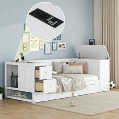 there is a bed with a remote control on top of it and pictures above the bed