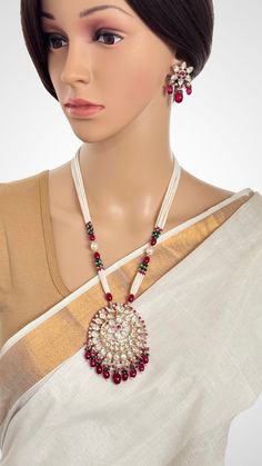 Ruby Premium Kundan silver foiled Mala Pendent Necklace gold Finish/Long Necklace/Indian Jewelry/Kundan Necklace/Mala/Indian wedding Color, shades, texture displayed may slightly vary from the actual product due to digital image limitations. We request you to consider these minor variations. Please expect the possibility of some slight imperfections when buying handmade jewelry. Please let me know if you have any questions. Arrives in a gift box. Thank you so much for visiting my shop. Silver Jewelry Sets For Puja And Festivals, White Chandbali Jewelry For Navratri, Traditional Temple Necklace With Round Pendant For Wedding, White Latkans Necklace For Wedding, White Wedding Necklaces With Latkans, White Jewelry For Navratri Ceremonial, Festive Kundan Temple Jewelry Necklace With Round Pendant, Festive Kundan Pendant Necklace With Latkans, Festive Temple Jewelry Kundan Necklace With Round Pendant