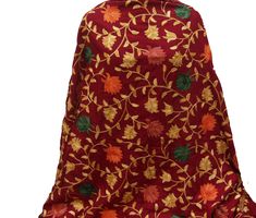 Pattern - red Kashmiri shawl with floral embroidery. Ideal for - women. Occasion - formal or casual. Fabric - cotts wool, it is a blend of cotton and wool which is very soft and has a fine texture. Color - maroon. On maroon background, embroidery is in different colored threads all over displaying floral patterns. Size - Width - 41 x 80 inches approx. Care- gentle hand wash. For more such scarves please visit- https://www.etsy.com/in-en/shop/vibrantscarves?ref=seller-platform-mcnav&section_i Elegant Burgundy Embroidered Dupatta, Traditional Floral Embroidered Shawl For Winter, Traditional Winter Shawl With Floral Embroidery, Winter Festive Embroidered Scarves, Elegant Red Shawl Dupatta, Elegant Red Dupatta Shawl, Elegant Red Embroidered Shawl, Red Festive Shawl Scarves, Festive Winter Shawl With Resham Embroidery