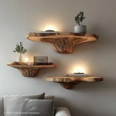 two wooden shelves with candles on them in a living room