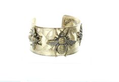 "Honey Bee or Mason Bee Hammered Cuff Bracelet, 1.5\" wide, antique gold, Made in USA, Each" Vintage Gold Cuff Bracelet With Antique Finish, Adjustable Antique Finish Gold Cuff Bracelet, Adjustable Gold Cuff Bracelet With Antique Finish, Gold Cuff Bracelet With Antique Finish And Adjustable Fit, Antique Gold Cuff Bracelet Bangle, Gold Antique Finish Cuff Bracelet, Gold Antique Finish Cuff Bangle, Gold Cuff Bracelet With Antique Finish, Gold Cuff Bracelet With Antique Finish As Gift