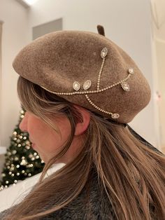 Indulge in luxury with our Embellished Jeweled 100% Wool French Beret Cap--a masterpiece of elegance and style. Adorned with intricate embellishments and jewels, this domed beret cap adds a touch of opulence to your ensemble. Crafted from 100% wool, it ensures both warmth and fashion-forward sophistication. Elevate your look and make a bold statement with this uniquely embellished and luxurious beret cap, perfect for those who appreciate the finest in fashion. Keywords: Embellished jeweled 100% wool French beret cap Luxurious statement hat Stylish domed beret with jewels Opulent embellishments headwear Fashion-forward 100% wool beret Intricate jewel-encrusted cap Unique wool beret Sophisticated jewel accents beret French style domed hat Finest fashion statement piece Elegant Flat Cap For Party, Elegant Embellished Hats For Formal Occasions, Elegant Fall Party Beret, Elegant Flat Cap For Fall, Elegant Evening Hats For Fall, Embellished Headpieces For Evening, Elegant Evening Hat For Fall, Elegant Embellished Formal Hats, Elegant Winter Party Cloche Hat