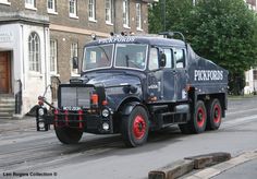 a large truck is driving down the street