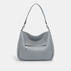 Deliberately slouchy with a sophisticated ease our Cary is a study in intentional laidback style. Crafted of buttery soft pebble leather with a silky sheen this surprisingly spacious bag has plenty of pockets to keep you organized. (Because even your most easygoing self should feel put-together.) | Coach Cary Shoulder Bag - Women's Purses - Silver/grey Blue Coach Cary Shoulder Bag, Thrift Manifestation, Women's Purses, Laidback Style, Shoulder Bag Coach, Laid Back Style, Womens Purses, Grey Blue, Hobo Bag