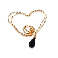 This delicate black stone necklace is the epitome of understated beauty. The pendant necklace is comprised of a genuine volcanic Obsidian stone and a beautiful chain in the length of your choice: 16 inch, 18 inch or 20 inch. The chain is dainty and delicate, making this a lovely piece for those that love modern, simple, and minimalist jewelry. As your finish, choose either Sterling Silver 925 or 14K Gold fill. The small and lightweight Obsidian is cut in a lovely teardrop shape and is expertly w Minimalist Teardrop Gemstone Drop Necklace, Elegant Black Drop Necklace Gift, Minimalist Teardrop Pendant Gemstone Drop Necklace, Elegant Black Drop Necklace, Minimalist Teardrop Crystal Necklaces, Black Teardrop Pendant Necklace Gift, Elegant Onyx Teardrop Necklaces, Elegant Black Teardrop Pendant Drop Necklace, Minimalist Black Teardrop Pendant Necklace