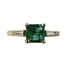 Vintage 14 Karat Yellow Gold Emerald and Diamond Ring Size 6 JAGi Certified- This elegant ring features one square cut emerald and two baguette diamonds set in classic 14K yellow gold. Width: 6 mm. Shank: 2 mm. Total emerald weight: .76 ct. Total diamond weight: .10 ct. Diamond color: G-H Diamond clarity: VS1-VS2 Size: 6 Weight: 3.5 gr./ 2.3 dwt. Stamped: 14KP JAGi Certificate included. Very good condition, professionally polished. Will come packaged in a gift box or pouch (when possible) and wi Emerald Diamond Ring, Baguette Diamonds, Square Cut, Elegant Ring, Baguette Diamond, Emerald Diamond, Diamond Clarity, Cocktail Rings, Colored Diamonds