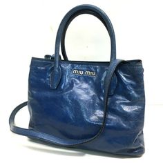 Item Information ITEM NO.: 22000-14453-11 NAME: MIUMIU Shoulder Bag Logo Hardware Hand Bag Hand Bag COLOR: blue MATERIAL: Leather APPROX SIZE: W10.2×H7.9×D5.1inch / W26cm×H20cm×D13cm Listed hand measurements may have a 1-2cm difference. Gender: Women's Spec: [Open type]Magnet type [Inside] Zipper pocket x 2,Open pocket x 1 ADDITIONAL ITEMS: Dust Bag , Shoulder strap , ITEM RANK: Used AB Rank CONDITION DETAILS: Outside:fading of color Handle - Strap:Wrinkles,fading of color Metal fittings part:Mi Luxury Blue Shoulder Bag For Daily Use, Designer Blue Bag With Top Carry Handle, Luxury Blue Shoulder Bag, Designer Blue Shoulder Bag For Daily Use, Designer Blue Bag With Double Handle, Luxury Blue Shoulder Bag With Top Carry Handle, Designer Blue Satchel Shoulder Bag, Luxury Blue Top Handle Bag, Miu Miu Leather Shoulder Bag For Shopping