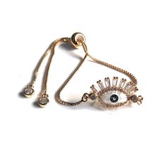 "Evil Eye Gold Bracelet This is a bolo chain modern bracelet gold plated completely adjustable with a gorgeous abalone stone and micro pave 1' / 2.5 cm oval shape evil eye 18K gold plated connector. It has a comfortable bead that you slide into position up and down the chain to allow the perfect fit. This bracelet is trendy, delicate, and easy to take on and off, simply slide the oval bead up to fit your wrist and pull it down to remove your bracelet. When wearing the bracelet the delicate chain Trendy Adjustable Gold Plated Bracelet, Trendy Adjustable Gold-plated Bracelet, Adjustable Gold-plated Chain Bracelet, Adjustable Gold Charm Bracelet For Party, Gold Bracelet With Adjustable Chain, Adjustable Gold Plated Chain Bracelet For Party, Adjustable Rose Gold Charm Bracelet For Parties, Adjustable Gold Plated Charm Bracelet, Adjustable Rose Gold Plated Bracelet