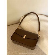 A shoulder bag with a square body and a flap that can hold a smartphone and a small wallet. The golden clasp and small design give it an elegant and stylish impression. It is also possible to remove the shoulder strap. 
 
 
 Color 
 
 Dark brown 
 Black 
 
 
 Size 
 
 
 FREE size 
 
 Height: 14cm 
 Width: 22cm 
 Depth: 6.5cm 
 
 
 
 
 
 Material 
 
 Leather Square Shoulder Bag, Square Body, Small Design, Small Wallet, Small Designs, Free Size, Dark Brown, Fashion Inspiration, Shoulder Strap