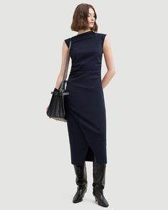 The elevated midi dress is a wardrobe must-have — Manon exudes effortless polish with its asymmetric neckline, ruched sides, and wrap front. We love to style it with a sleek pair of heeled boots for a desk-to-drinks look. See below for our general Size Guide and available measurements Made of 73% rayon, 23% nylon, and 4% spandex Machine wash cold and lay flat to dry Workwear Dresses With Side Slits, Chic Knee-length Midi Dress With Side Slits, Sleek Workwear Dresses With Side Slits, Sleek Work Dresses With Side Slits, Knee-length Formal Midi Dress With Ruched Sides, Chic Asymmetrical Midi Dress For Work, Knee-length Midi Dress With Ruched Sides For Formal Events, Formal Knee-length Midi Dress With Ruched Sides, Knee-length Ruched Midi Dress For Formal Occasions