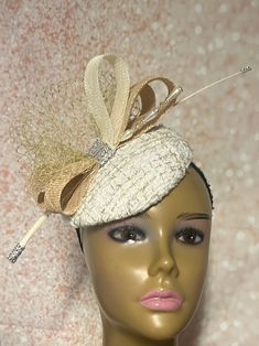 Cream Button Fascinator Half Hat for Church Head Covering, Tea Party, Wedding, and Other Special Occasions This cream circular hat is trimmed with veil and sinamay bows. Beautiful show-stopper! Mannequin is wearing size 6 inches. Available in 3 sizes  6 inches diameter 7 inches  8 inches  Hat affixes to head by hat string. Handmade gifts for mom, sister, wife, or yourself. Love what you see, but would like it in a different color, shape or size? Please contact us by sending a message. We offer custom hats in a variety of styles. PLEASE NOTE All items for Free Shipping will be shipped via USPS First Class Mail. Vintage Wedding Costume Hat With Pinched Crown, Vintage Wedding Hat With Pinched Crown, Party Bridal Hat Accessories, Vintage Headpieces For Wedding At Royal Ascot, Adjustable Vintage Fascinator For Wedding, Elegant Cream Fascinator For Vintage Events, Gatsby Style Wedding Fascinator With Short Brim, Fitted Mini Hat Headband For Vintage Events, Vintage Wedding Mini Hat With Pinched Crown