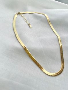 Dainty 18k Gold Herringbone Chain, Snake Layered Choker, Gold Plated Flat Snake Necklace, Valentine's Day, Birthday, Christmas Gift For Her. This trendy Snake Chain Choker is made of 18k gold plated with 316L stainless steel. This chic gold necklace consists of small rings that are connected tightly together to form a smooth, sleek snake chain. This smooth, silky, and shiny piece of jewelry is something to have your heart on. When it comes to classic, effortless jewelry, the herringbone necklace Snake Choker Necklace, Gold Herringbone Chain, Gold Snake Chain, Choker Gold, Herringbone Chain, Layered Chokers, Herringbone Necklace, Snake Necklace, Christmas Gift For Her