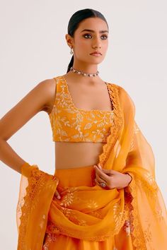 Orange silk chanderi attached cancan lehenga featuring floral hand-painting and zari embroidery. Paired with a matching zari embroidered blouse and a sheer silk organza laced dupatta. - Aza Fashions Traditional Art Silk Palazzo Set With Unstitched Blouse, Designer Silk Anarkali Set With Unstitched Blouse, Designer Silk Sharara With Unstitched Blouse, Bollywood Style Silk Sharara With Unstitched Blouse, Designer Wear Silk Choli With Cutdana, Silk Anarkali Set With Unstitched Blouse, Anarkali Style Chanderi Sharara With Unstitched Blouse, Festive Palazzo Set With Unstitched Blouse In Chanderi, Silk Palazzo Set For Reception And Festivals