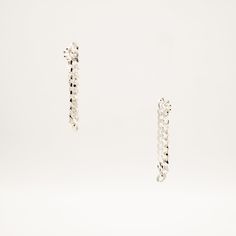 An edgy versatile wardrobe essential, the Dangling Sterling Silver Cuban Chain Earrings were lovingly handmade for the everyday slay in mind. Look like a Rockstar when earrings are worn as a single, paired, or styled asymmetrically with any of our jewelry. Sold as a Single or Pair, for head-turning looks. Solid Sterling Silver Cuban Chain 4.6mm width About 1.75" drop, 3" chain length In-stock jewelry ships within a 2-3 day process. If SOLD OUT on TikTok Shop, pre-order online via link in bio und Trendy Silver Chain Link Earrings, Silver Chain Earrings For Everyday, Sterling Silver Chain Drop Earrings, Sterling Silver Earrings With Adjustable Chain For Everyday, Modern Drop Earrings With Silver Chain, Modern Silver Chain Drop Earrings, Single Silver Earring In Edgy Style, Trendy Sterling Silver Drop Cartilage Earrings, Silver Single Earring In Edgy Style