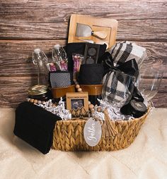 a basket filled with items sitting on top of a bed