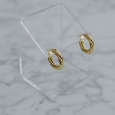 "Pair them with gold rings and necklaces to get a full elegant look. These thick twisted earrings take you to a higher level of the Parisian style - chic, bold and simple. - Materials: 18K gold plated brass and sterling silver posts - Measurements: approximately 0.9\" / 2.3cm in diameter - Note: one earrings is about 7.4g / 0.26oz - The product is tarnish-resistant. The posts are hypoallergenic Q&A 1. What is the material? - It is made from 18K real gold plated brass and sterling silver post Chic Gold Hoop Earrings Hypoallergenic, Elegant Twisted Tarnish-resistant Hoop Earrings, Elegant Twisted Hoop Earrings For Everyday, Elegant Twisted Huggie Earrings Gift, Elegant Twisted Gold Plated Hoop Earrings, Chic Twisted Hoop Earrings, Gold Twisted Hoop Earrings Minimalist Style, Minimalist Twisted Gold Hoop Earrings, Minimalist Gold Twisted Hoop Earrings