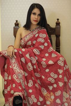 Add a touch of traditional elegance to your wardrobe with this beautiful saree. The saree is made of high-quality fabric and features intricate Aari and Tilla embroidery in a stunning shade of red. The saree is easy to drape, making it perfect for any occasion. Whether you're attending a wedding or a formal event, this saree is sure to make you stand out in the crowd. The embroidery work is done by skilled artisans who have years of experience in the craft. Each saree is made with great attentio Tussar Silk Pre-draped Saree For Traditional Ceremonies, Anarkali Chikankari Pre-draped Tussar Silk Saree, Designer Pre-draped Saree With Chikankari Embroidery, Traditional Designer Pre-draped Saree, Designer Chanderi Pre-draped Saree With Chikankari Embroidery, Bollywood Chanderi Saree With Chikankari Embroidery, Designer Chikankari Chanderi Pre-draped Saree, Unstitched Bollywood Saree With Chikankari Embroidery, Bollywood Style Art Silk Saree With Chikankari Embroidery