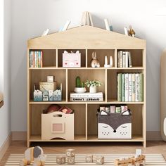 a child's room with toys and bookshelves on the floor in front of it