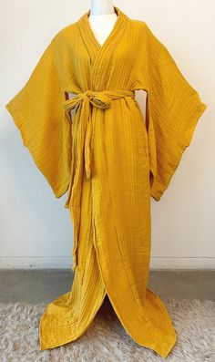 This dreamy handmade kimono style robe is insanely comfortable and effortlessly chic. The robe is voluminous and adjustable, with a long belt to tie the garment as tightly or loosely as desired. Traditional vents underneath the arms allow for extra aeration and room for the bust. The garment cam also be worn as a duster style jacket! The cotton double gauze fabric is lightweight yet warm, airy, and wonderfully soft.  Care: Machine wash gentle cold, Non-chlorine bleach, reshape, lay flat, cool iron Chartreuse Silk Robe, Bohemian Belted Kimono With Kimono Sleeves, Bohemian Belted Kimono, Belted Wrap Kimono For Loungewear, Chic Long Robe For Loungewear, Chic Robe With Tie Waist For Loungewear, Chic Long Loungewear Robe, Long Sleeve Belted Kimono For Loungewear, Belted Long Sleeve Kimono For Loungewear