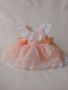 Lase blessing dress baby . This pink or white lace dress truly is rustic simplicity at its finest! Cascades of lace ruffle top and tulle skirt with stunning lace trim (one piece). Perfect to wear as a flower girl dress in a rustic country wedding, birthdays, Christening, baptism, special occasions and more. Lace Princess Dress With Ruffles For Wedding, Lace Princess Dress With Ruffles For First Communion, Lace Dress For First Communion In Summer, Peach Ruffled Dresses For Wedding, Peach Ruffled Wedding Dress, First Communion Princess Dress With Lace Trim, Cute Lace Princess Dress For Party, Spring Princess Dress With Lace Sleeves, Fitted Lace Princess Dress With Ruffles