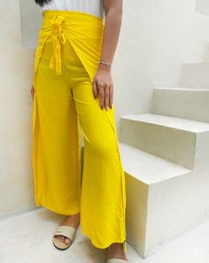 - Original Jepun Warp Pants - Made of Soft Cotton, Rayon, Lightweight ITEMS DESCRIPTION : A smooth moving and comfortable yet stylish culottes for women! Our collection is homemade and tailored with love and care to the details by our local tailors. This is made especially for summer wear collection as it is made from good quality rayon material in bright yellow color which is breathable, refreshing, soft and super comfortable. This pant has added side cleavage to provide more free movement space for you who is an active individual. There is also adjustable fabric belt in the waistline to fit your need. You can use this pants for all sorts of activities such as relaxing on the beach or at home, Massage, Talk a walk, Spa, Travel, Sleep, Hippie, Dance, Party or Mums to be. ■ DETAILS Fits all High Waist Yellow Pants For Vacation, Yellow Stretch Pants For Summer, Summer Stretch Yellow Pants, High Waist Yellow Bottoms With Elastic Waistband, Yellow Wide Leg Pants For Day Out, Yellow Bottoms For Spring, Yellow Long Pants For Spring, Mustard Wide Leg Bottoms For Summer, Yellow Wide Leg Bottoms For Spring