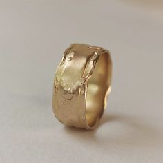 Handmade Thick Band Jewelry As Gift, Handmade Anniversary Ring With Thick Band, Artisan Untreated Wedding Jewelry, Artisan Untreated Jewelry For Wedding, Handmade Thick Band Wedding Jewelry, Handmade Recycled Gold Promise Ring, Handmade Thick Band Jewelry For Wedding, Rustic Hammered Gold Jewelry, Minimalist Hand Cast Wedding Rings