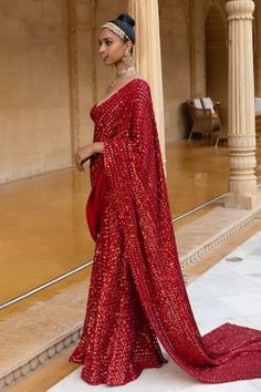 Red pre-draped saree with mirror, cutdana, sequin embroidery in geometric pattern. Paired with sweetheart neck embroidered blouse.
Components: 2
Pattern: Embroidery
Type Of Work: Mirror, cutdana, sequin
Neckline: Sweetheart neck
Sleeve Type: Sleeveless
Fabric: Georgette
Color: Red
Other Details: 
Back deep square neck
Occasion: Bride,Reception - Aza Fashions Red Pre-draped Saree For Party, Red Saree For Evening With Traditional Drape, Red Evening Saree With Traditional Drape, Red Draped Lehenga For Party, Floor-length Pre-draped Saree With Dupatta For Celebration, Red Pre-draped Saree For Festive Evening, Red Pre-draped Saree With Zari Work For Evening, Floor-length Saree With Mirror Work For Celebration, Evening Saree With Mirror Work In Traditional Drape