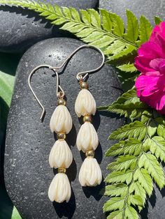 Pikake Dangle Earring with gold beads Earrings. Depth of color of beads may vary. Please note size comparison in the photo with quarter. Gold Beaded Teardrop Pearl Earrings, Gold Flower Earrings With Dangling Beads As Gift, Gold Beaded Long Drop Earrings, Nickel-free Cream Dangle Jewelry, Elegant Gold Flower Earrings With Dangling Beads, Cream Dangle Earrings Nickel Free, Nickel Free Cream Dangle Earrings, Adjustable Teardrop Earrings With Gold Beads, Gold Beaded Long Drop Earrings As A Gift