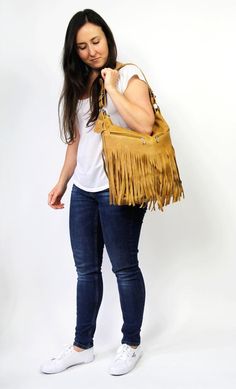 LEATHER FRINGE - leather boho fringe handbag.This hobo is the perfect size to carry your daily essentials in style! It is made from high quality leather.This leather bag can be used as a tote and messenger bag. By using the adjustable leather strap you can convert it into a crossbody bag.This leather bag is a perfect everyday bag! There is a lot of space and you can put there everything in your everyday life.* Lining* An external pocket on the back* Includes internal pockets for mobile phone and Everyday Bucket Shoulder Bag With Tassels, Bohemian Crossbody Satchel With Fringe, Daily Use Fringe Satchel Shoulder Bag, Bohemian Fringe Crossbody Satchel, Fall Fringe Shoulder Bag For Daily Use, Everyday Use Fringe Shoulder Bag, Fall Fringe Satchel Bag, Fringe Shoulder Bag For Fall, Fall Fringe Shoulder Bag