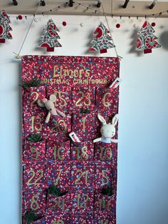 a red door decorated with christmas decorations and bunting