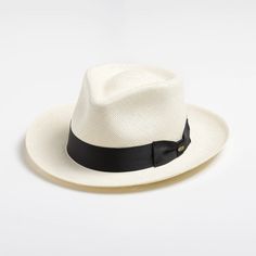 This bleached white panama fedora is a real looker. It has a teardrop crown and features wire in the brim for minor shape adjustments. Brim can be worn as shown in the picture or "snapped" up. It comes finished with a 16-Ligne grosgrain ribbon around the crown, a discrete bow and a removable Scala emblem. Additional information: Scala Panamas come with an "uncrushable" insert in the crown which prevents cracking from normal wear and tear. In addtion they come finished with a tefllon coating to repel mild water and oil based spills. Brim: 2 5/8" Crown: Front: 4" Side: 4 1/2" Upf Clothing, Outback Hat, Mens Hats Fashion, Straw Fedora Hat, Mens Hats, Hats Fashion, Straw Fedora, Weekend Warrior, Grade 3