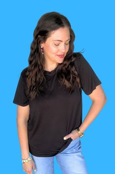 Your ultimate favorite black tee for comfort and style: Our original signature tee is every bit of amazing with its buttery soft feel and boxy fit. This jersey knit top is our (and hopefully your) go-to top. Designed to elevate your everyday wardrobe and crafted with attention to detail, this tee redefines casual elegance. It is practical, comfortable and truly the best fit. You may consider sizing down because of the boxy fit, but most stick true to size for the slouchy look. 94.9% model, 5.1% Trendy T-shirt For Casual Gatherings, Versatile T-shirt With Shirttail Hem, Black Crew Neck Versatile Top, Black Relaxed Fit Trendy Short Sleeve Top, Trendy Solid T-shirt For Casual Gatherings, Trendy Black Relaxed Fit Short Sleeve Top, Trendy Solid Color T-shirt For Casual Gatherings, Versatile Black Loungewear Tops, Black Stretch T-shirt For Everyday