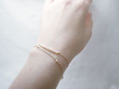 "Double strand beaded bar bracelet - dainty jewelry Tiny baby pink beads beaded on 14K gold filled chain. Double chain bracelet that's femininely dainty in soft shades of gold and blushing pink. measurements bead bar length 1\" please choose length at checkout ♦you can enter shop here! http://etsy.com/shop/illusy" Dainty Yellow Gold Beaded Bracelets In 14k Gold Filled, Adjustable Delicate 14k Gold Beaded Bracelet, Delicate Adjustable 14k Gold Beaded Bracelet, Minimalist Everyday Beaded Bracelet With Delicate Chain, Dainty Beaded Bracelets With Satellite Chain For Gifts, Dainty Beaded Bracelets With Adjustable Chain, Delicate 14k Gold Filled Bracelets For Everyday, Dainty 14k Gold Beaded Bracelets, Delicate Adjustable Chain Bracelet With Tiny Beads