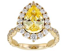 a fancy yellow diamond ring with white and yellow diamonds on the band, set in 18k gold