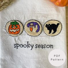 three embroidered halloween appliques with the words spooky season on them