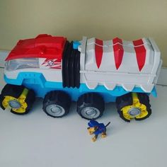 there is a toy truck with wheels on the table