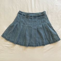 Denim Pleated High Waist Mini Tennis Skirt. Never Worn. Casual Denim Skort For Day Out, Casual Blue Denim Skirt, Blue Mid-rise Cotton Skort, Pleated Medium Wash Denim Bottoms, Casual Denim Blue Pleated Mini Skirt, Casual Pleated Denim Blue Skirt, Blue Denim Skort For Day Out, Blue Pleated Mini Denim Skirt, Casual Medium Wash Pleated Denim Skirt