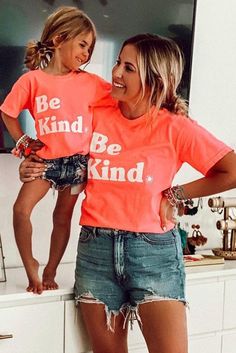 Orange Be Kind Graphic Family Matching Outfit Mom T-shirt Orange Short Sleeve T-shirt With Letter Print, Orange Short Sleeve T-shirt With Text Print, Orange Text Print Top For Summer, Summer Orange Tops With Slogan, Orange Summer Tops With Text Print, Fun Short Sleeve Tops With Letter Print, Family Matching Slogan T-shirt With Crew Neck, Family Matching Short Sleeve Summer T-shirt, Orange Relaxed Fit T-shirt With Letter Print