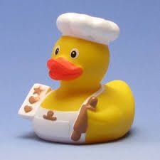 a yellow rubber ducky with a chef's hat on