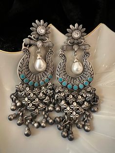 One-of-a-kind designer piece handcrafted by our skilled Indian craftsmen from Jaipur in real silver and turquoise stones and fresh water pearls This piece is a perfect example of art meets fashion.  Metal purity: 92.5 pure silver  Hallmarked The length of the earrings is 9.5 cm The width of the earrings is 3.5 cm The weight of the earrings is 53 grams per pair. Turquoise Jewelry With Matching Earrings For Festivals, Turquoise Dangle Jewelry For Festivals, Handmade Traditional Turquoise Chandelier Earrings, Traditional Turquoise Sterling Silver Earrings, Traditional Turquoise Earrings With Latkans, Traditional Turquoise Danglers For Gift, Silver Jewellery Indian Earrings, Pure Silver Jewellery Indian, Antique Silver Jewelry Indian