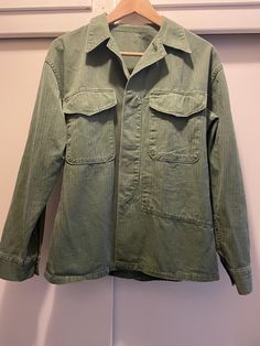 Vintage Dutch military shirt. The shirt is green with old style material. Pit to pit is approximately 20", arm length without cuff is approximately 20.5".  Contact us with any questions. Green Cotton Utility Shirt, Olive Long Sleeve Cotton Shirt, Olive Military Style Tops For Fall, Khaki Long Sleeve Utility Top, Green Military Style Tops For Fall, Khaki Collared Military Shirt, Military Style Green Tops For Fall, Khaki Military Collared Shirt, Olive Military Style Cotton Top