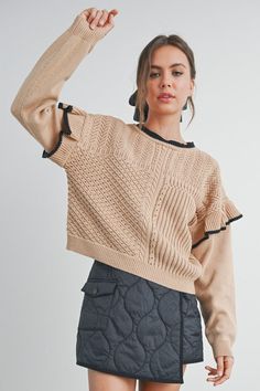 Elevate your style with our Ruffled Shoulder Knitted Sweater. Crafted from a soft, cozy knit, this sweater features charming ruffled shoulders that add a touch of femininity and flair. Perfect for both casual outings and dressier occasions, it pairs beautifully with jeans or skirts. Available in a range of versatile colors, this sweater is a must-have addition to your wardrobe for a chic, effortless look. Spring Cable Knit Cropped Sweater, Chic Long Sleeve Sweater With Ruffles, Spring Cable Knit Sweater, Spring Cable Knit Stretch Sweater, Ruffled Knit Top For Layering, Chic Textured Knit Cropped Sweater For Layering, Chic Pointelle Knit Sweater, Chic Knit Cropped Sweater For Spring, Trendy Pointelle Knit Cropped Sweater For Fall