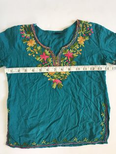 This top is in great condition and it's super soft cotton with stunning floral embroidery. It's best fitted for a 4-6 year old with measurements provided in the photos for an accurate fit. It's the perfect little hippie top to tuck into ol' Levis or bloomers ✌🏽 (5) Bohemian Short Sleeve Tops For Spring, Bohemian Tops With Embroidered Hem For Festivals, Floral Embroidered Tunic Top For Festival, Bohemian Festival Top With Embroidered Hem, Bohemian Summer Peasant Top With Embroidered Hem, Spring Bohemian Embroidered Tunic Top, Bohemian Spring Embroidered Tunic Top, Bohemian Peasant Top With Embroidered Hem For Summer, Spring Bohemian Embroidered Cotton Top