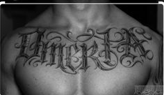 a man's chest with the word tattoo on it