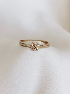 Double Knot Ring, Love Knot Ring, Gold Double Knot Ring, Knot Ring Gold, Gold Stacking Rings, Gold Knot Ring, Silver Knot Ring   This Ring is so lovely and gorgeous. Created from solid 14k gold-filled, or sterling silver round wire, this ring features an open heart-shaped with a love-knot design and presents an attractive, dainty look. Marerial: * 14K gold filled * 925 sterling silver  * 14K rose gold filled *CURRENT PRODUCTION WORKS* All items are made to order. Please check our policies page, Promise Ring Infinity, Gold Rings Promise, Love Knot Jewelry, Simple Gold Band Ring, Promise Ring Bands, Dainty Promise Rings Simple, Jewelry With Meaning, No Stone Engagement Ring, Jewelry Design Rings