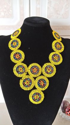 Yellow Zulu Beaded Necklace, Zulu African Beaded Jewelry, African Necklace, Handmade Necklace, Multi color Necklace, Gift For Her, NecklaceThis colorful beaded necklace is superbly crafted which can be worn with any outfit at different occasions and it will absolutely makes you stand out.Main color - yellow.The necklace can be available in different colors.Wholesale available at a fair price,please contact me.For any clarification,please send me a convo or an e-mail.Thank you for visiting and ha Colorful Beaded Necklaces For Jewelry Making, Yellow Beaded Bib Necklaces With Round Beads, Handmade Yellow Beaded Necklaces With Round Beads, Multicolor Beaded Necklaces With Bead Caps, Handmade Yellow Beads For Jewelry Making, Beaded Yellow Necklace As Gift, Multicolor Round Bead Necklaces With Bead Caps, Yellow Beaded Necklace As Gift, Yellow Necklaces With Large Beads For Crafting