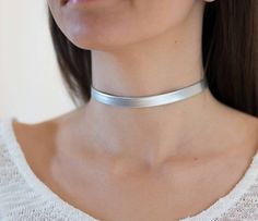 "silver Choker Necklace, Tattoo choker Necklace, Faux Leather Choker, Dainty Choker Necklace, Boho Chic Choker, Neck Choker, Silver Choker I LOVE this Faux Leather Silver choker necklac , this choker is a MUST have for your wardrobe , this necklace is perfect for any kind of weather time or type of women .We ladies love to keep it simple and trendy. Unless stated otherwise, the length of our chokers band is 11\"-12\" inches and includes a 3\" inches Silver/Gold Plated chain extender attached for Gold Neck Choker, Tattoo Choker Necklace, Necklace Tattoo, Choker Necklace Silver, Dainty Choker Necklace, Simple Choker, Tattoo Choker, Choker Silver, Dainty Choker