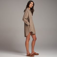 The Merritt has an easy, flowing drape and can be worn as loose top layer, a duster, or on its own as a dress. Made from luxe Tencel, a plant-based, eco-friendly fiber produced with with low amounts of water and a low carbon footprint. It is durable yet ultra-soft with an easy drape. The asymmetrical set-in and patch front pockets and double stitch reinforced placket and hem speak to classic utility with a modern, casual elegance. The double stitch reinforced inverted back pleat with triangle ta Spring Relaxed Fit Shirt Dress For Daywear, Fall Tunic For Loungewear, Oversized Spring Tunic For Loungewear, Linen Shirt Dress For Day Out In Fall, Fall Linen Shirt Dress For Day Out, Relaxed Fit Tunic Shirt Dress For Spring, Spring Relaxed Fit Tunic Shirt Dress, Neutral Long Sleeve Shirt Dress For Daywear, Casual Tunic Shirt Dress For Daywear