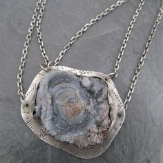 "Large Druzy Pendant Chalcedony Rose Necklace Sparkling Raw Gemstone Neckpiece: This is a stunning, one-of-a-kind neckpiece featuring a natural, raw, sparkling Chalcedony \"rose\" also known as \"Desert Rose\", is hand set on a stamped backplate and suspended from a sterling silver chain that's approximately 18 3/4\" in length. The stone is a sparkly gray with hints of pale blue and cream. Pendant measures approximately 1 1/2\" by 1 3/4\". All handmade in my little home studio. Enter my shop: ht Pink Gemstone Necklace, Cat Necklace Silver, Long Silver Earrings, Gemstone Hoop Earrings, Rainbow Moonstone Necklace, Druzy Jewelry, Rainbow Moonstone Pendant, Art Jewelry Contemporary, Rose Necklace